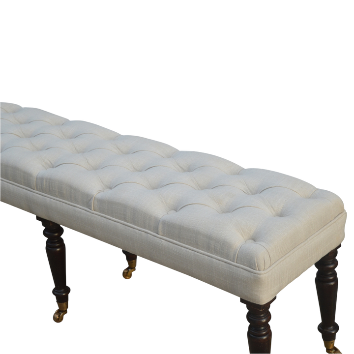 Close view of the button tufting and upholstery on the Grosvenor Hall Bench in Espresso and Alabaster.