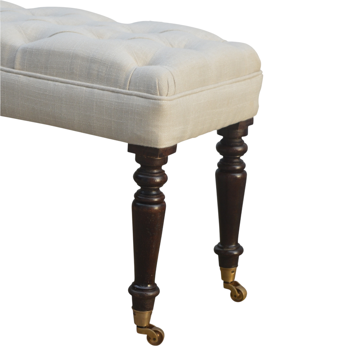 Close view of the turned legs on the Grosvenor Hall Bench in Espresso and Alabaster.