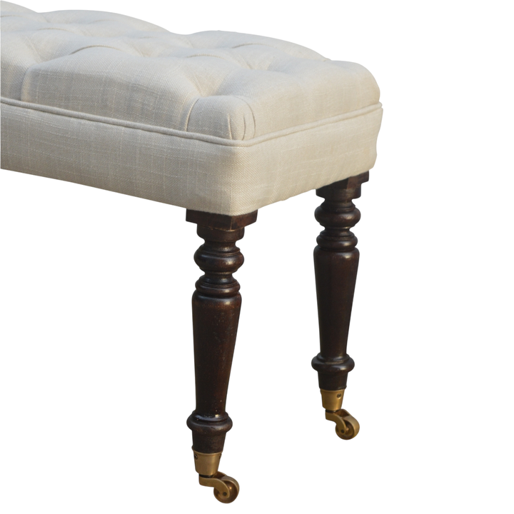 Close view of the turned legs on the Grosvenor Hall Bench in Espresso and Alabaster.
