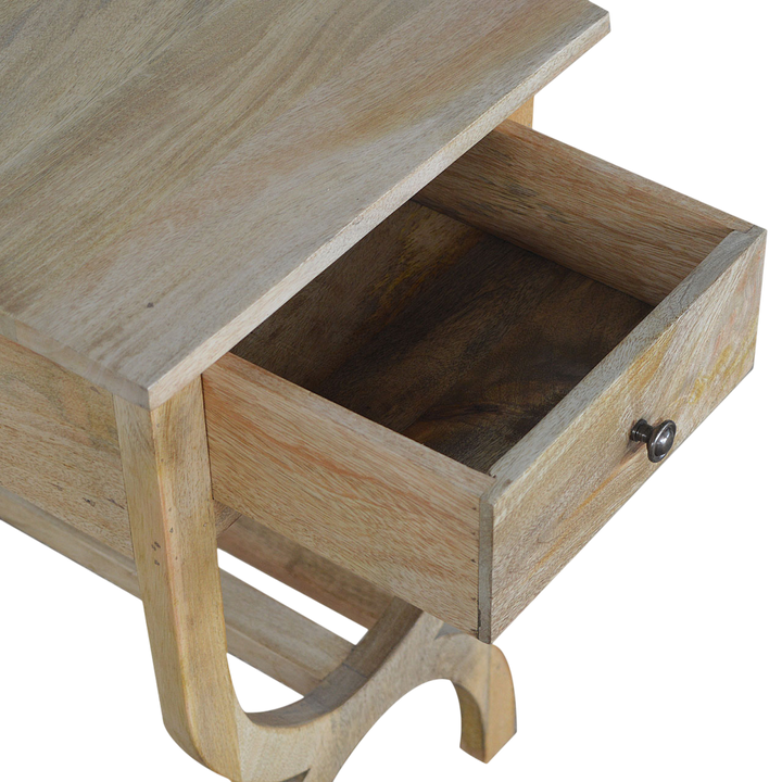 Grosvenor Serpentine Bedside Table in Amber, shown with a drawer open.