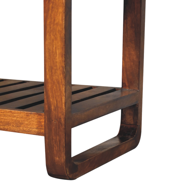 Close view of the slatted frame on the Grosvenor Slatted Hall Bench in Chestnut with Tobacco Leather.