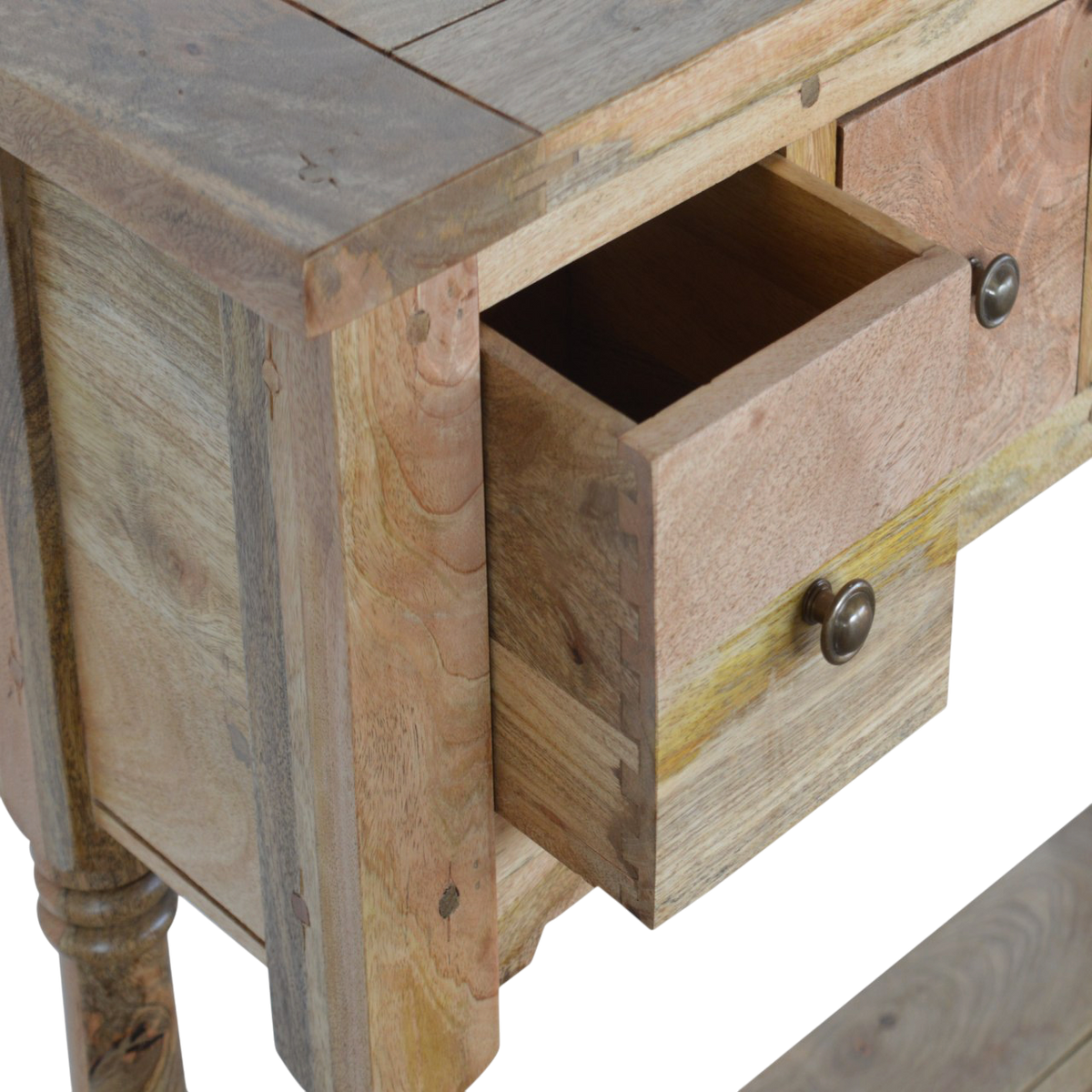 Haldon 4-Drawer Console Table in Driftwood, shown with a drawer open.