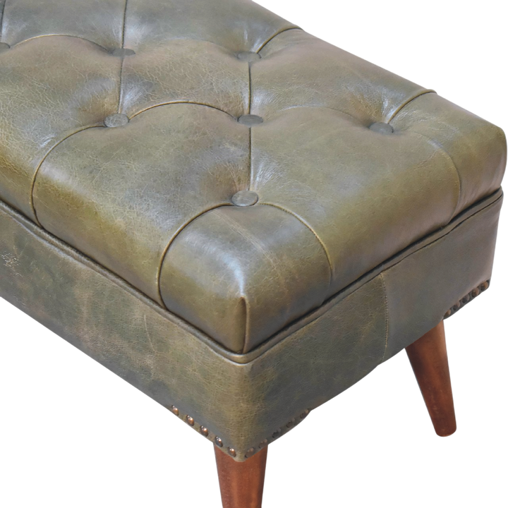 Close view of the hand-set buttoning on the Haldon Bench in Olive Leather.