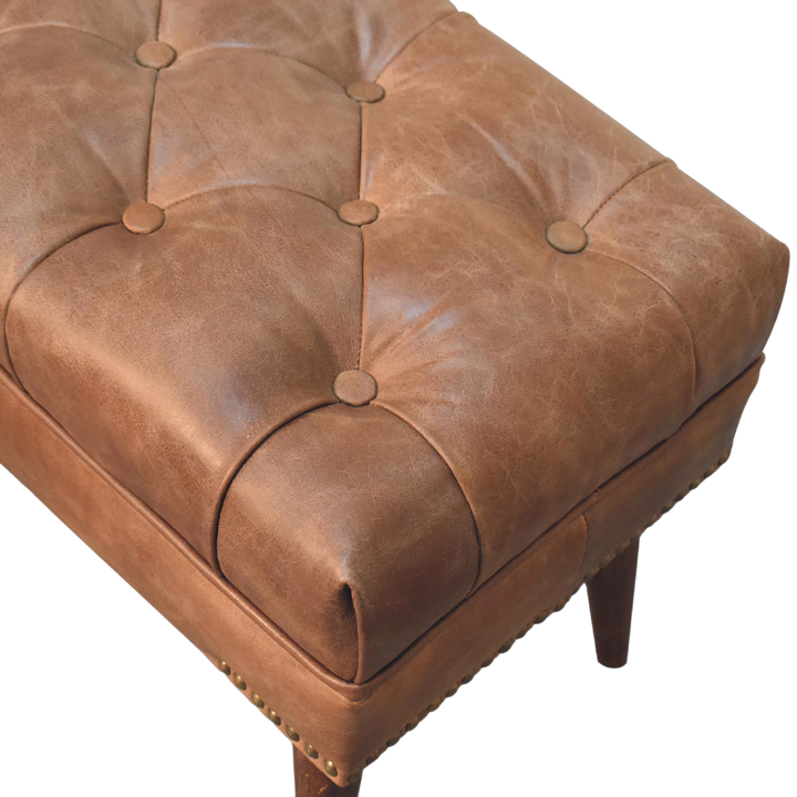 Close view of the hand-set buttoning on the Haldon Bench in Tobacco Leather.