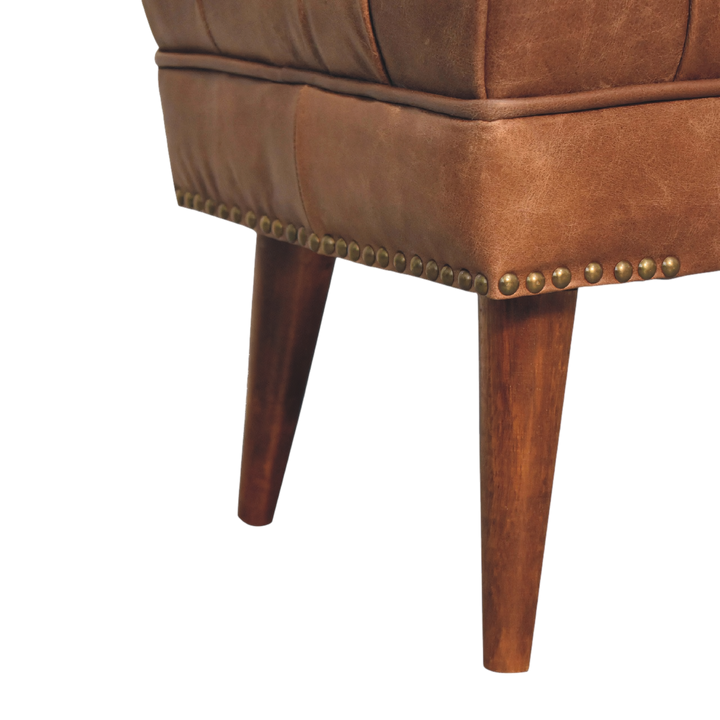 Close view of the stud trim on the Haldon Bench in Tobacco Leather.