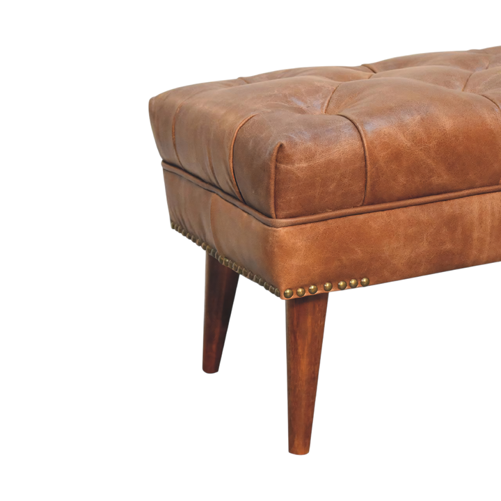 Close view of the turned legs on the Haldon Bench in Tobacco Leather.
