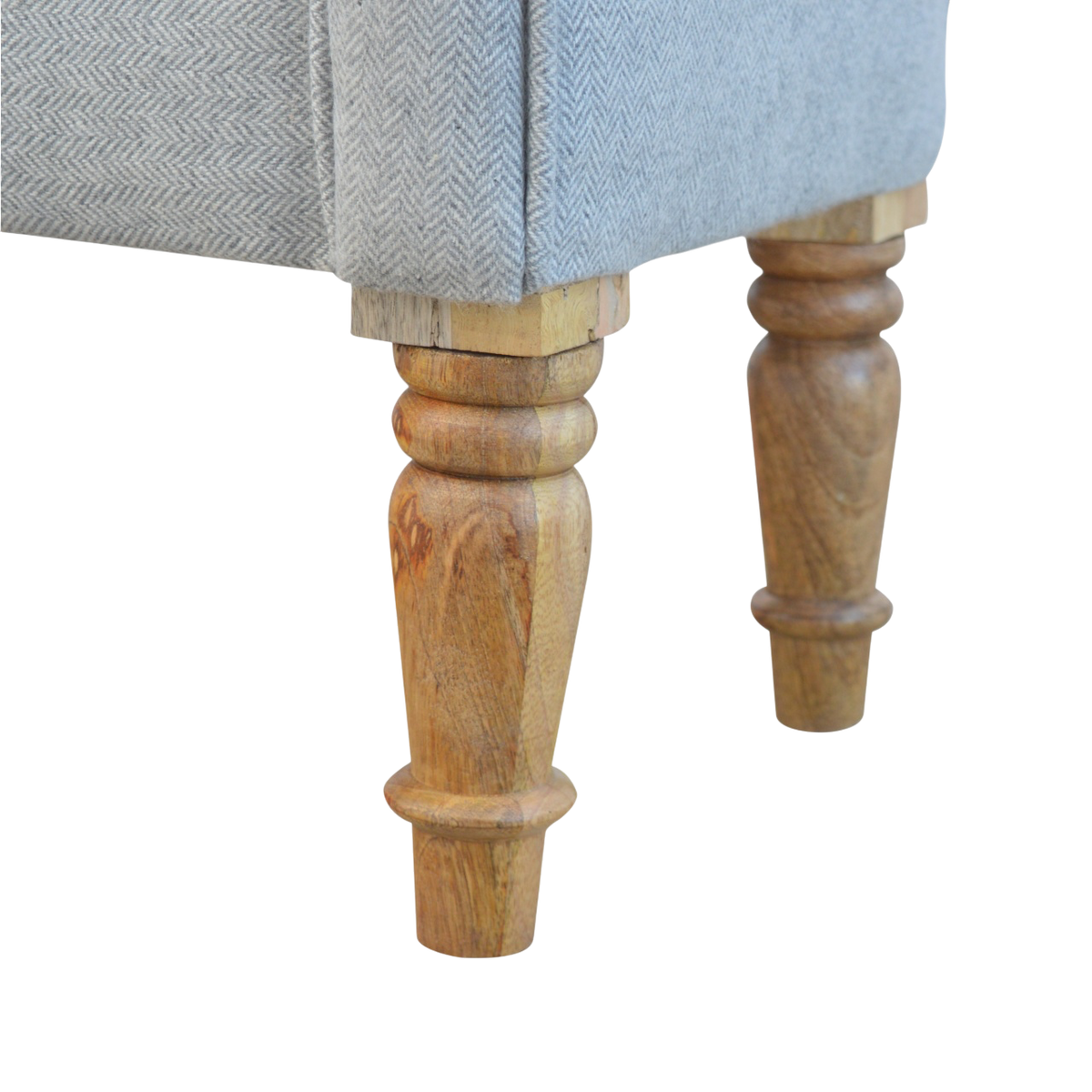 Close view of the turned legs on the Hampstead Roll-Arm Bench in Dove Tweed.