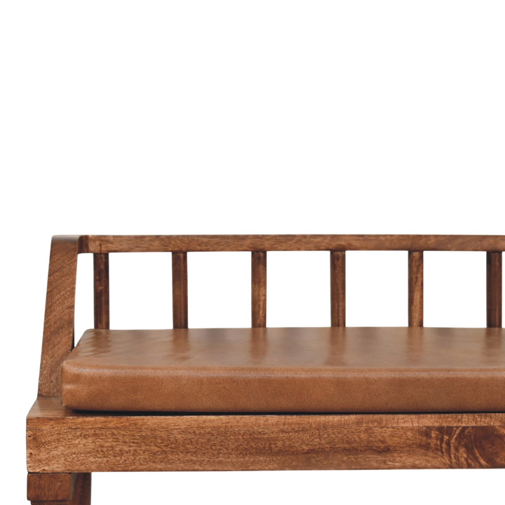 Close view of the turned spindle back on the Kelso Bench in Chestnut with Tobacco Leather.