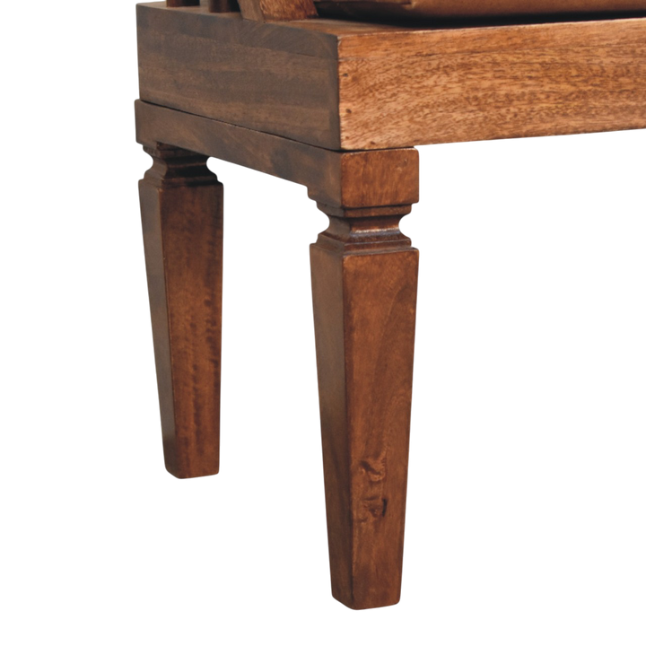 Close view of the turned legs on the Kelso Bench in Chestnut with Tobacco Leather.