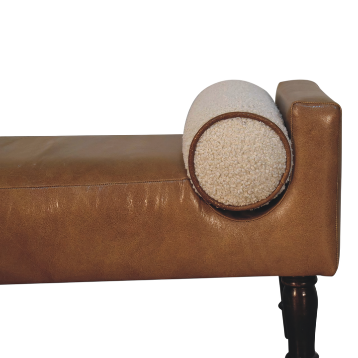 Close view of the arm on the Kelso Leather Bench in Tobacco with Cream Bouclé.