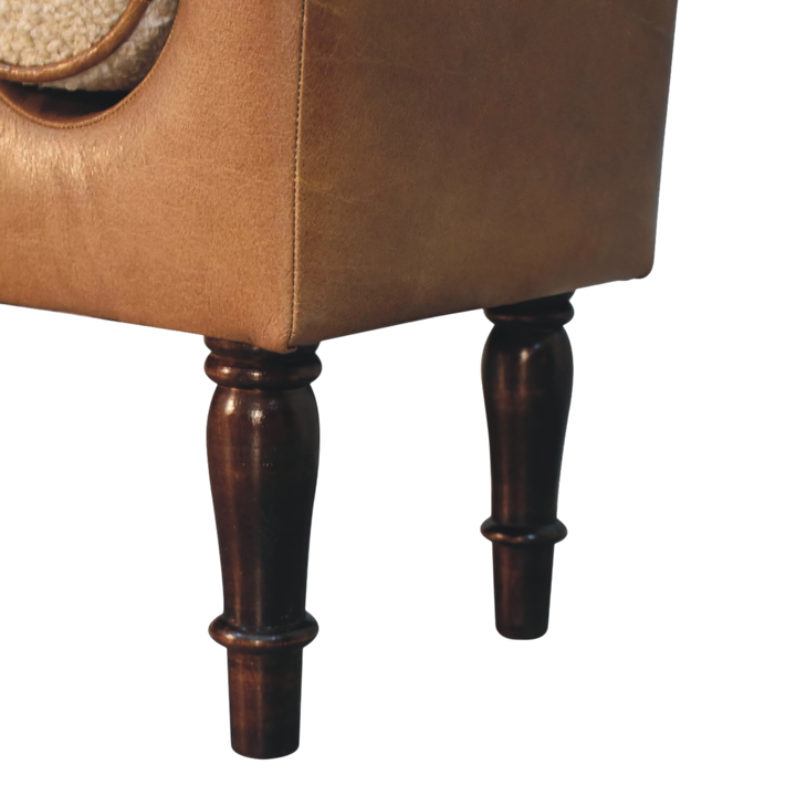 Close view of the turned legs on the Kelso Leather Bench in Tobacco with Cream Bouclé.