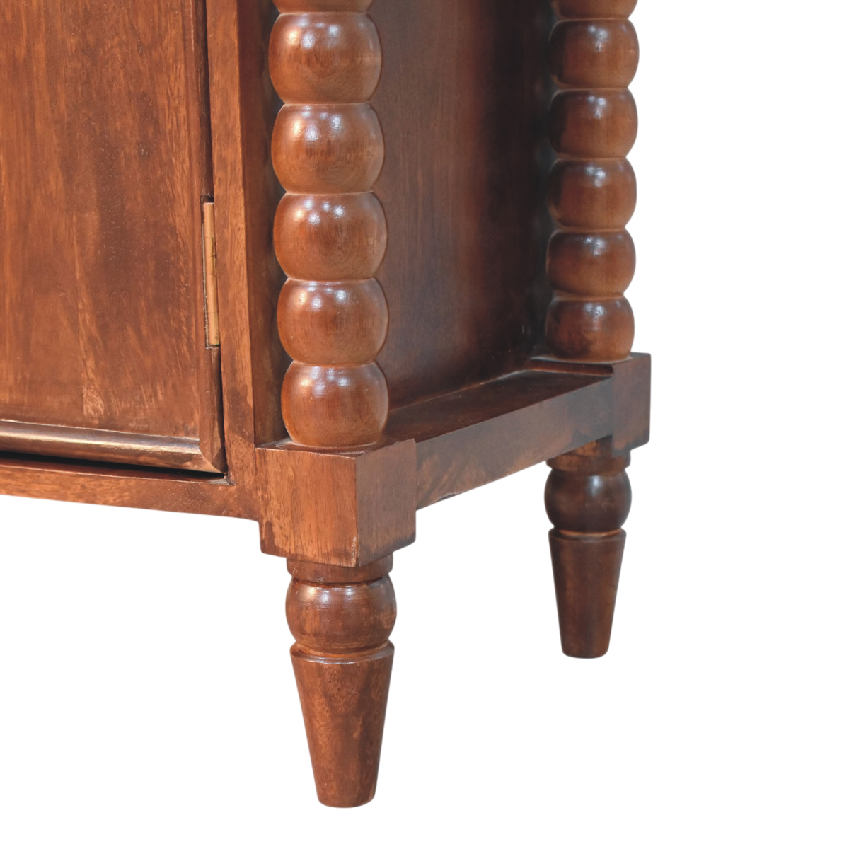 Close view of the bobbin turning on the Langham 2-Door Cabinet in Claret.
