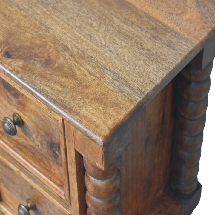 Close view of the bobbin turning on the Langham 2-Drawer Bedside Table in Amber.