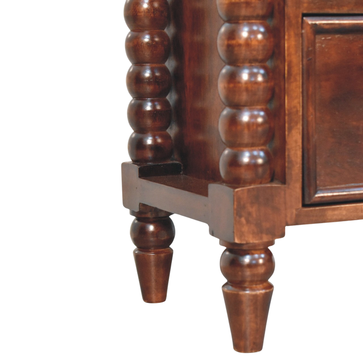 Close view of the bobbin turning on the Langham 2-Drawer Bedside Table in Claret.
