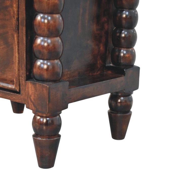 Close view of the bobbin-turned detailing on the Langham 2-Drawer Bedside Table in Espresso.