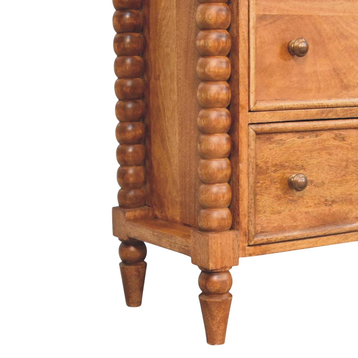 Close view of the bobbin turning on the Langham 3-Drawer Dresser in Amber.
