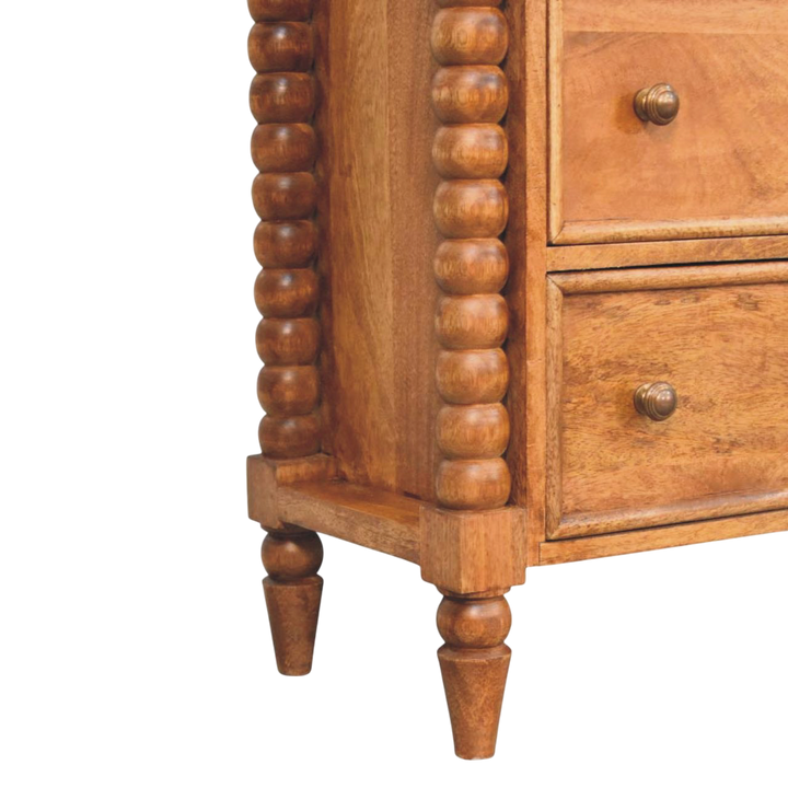 Close view of the bobbin turning on the Langham 3-Drawer Dresser in Amber.