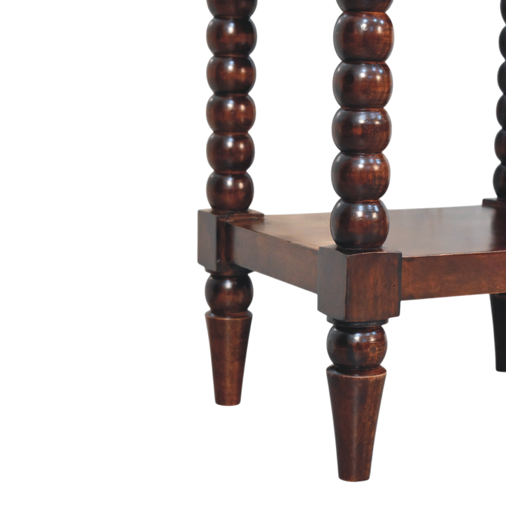 Close view of the bobbin turning on the Langham Bedside Table in Claret.