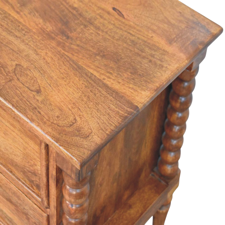 Close view of the bobbin turning on the Langham Grand 2-Drawer Bedside Table in Amber.