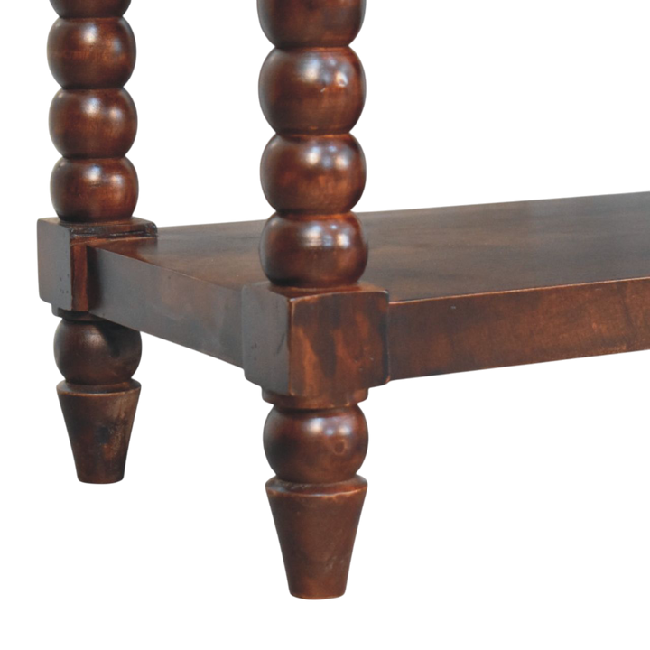 Close view of the turned legs on the Langham Hall Bench in Claret with Caramel Leather.