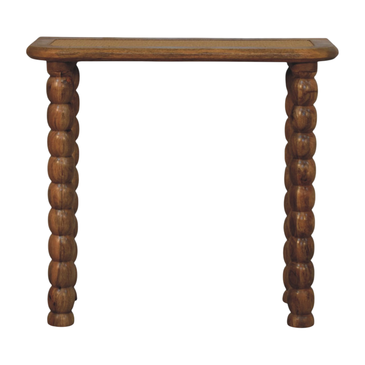 Langham Rattan-Top Console Table in Amber with Natural Rattan, front view. 100% solid hardwood in a warm amber finish, woven rattan inlay to the top, turned spindle legs.