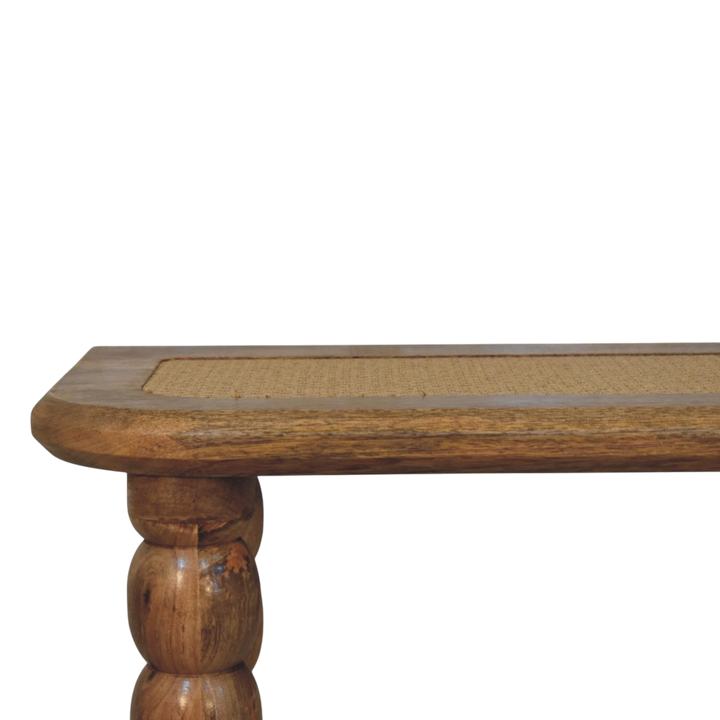 Close view of the legs on the Langham Rattan-Top Console Table in Amber with Natural Rattan.