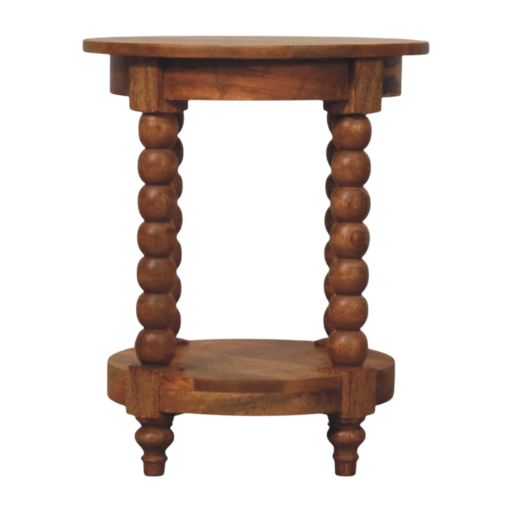 Langham Round Side Table in Amber, front view. 100% solid hardwood in a warm amber finish, turned spindle legs, open lower shelf.