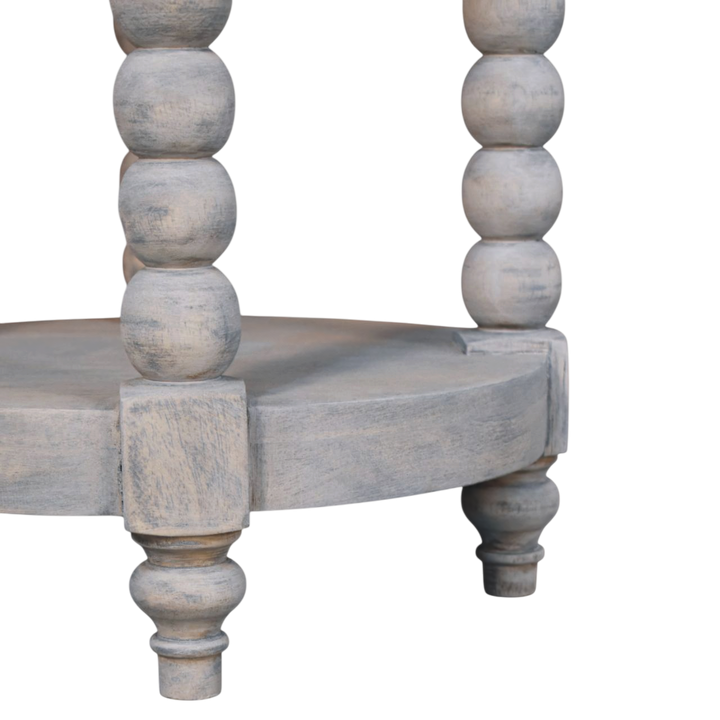 Close view of the bobbin turning on the Langham Round Side Table in Salt.