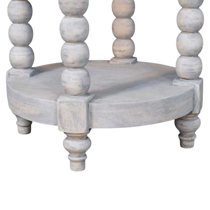 Close view of the shelf on the Langham Round Side Table in Salt.