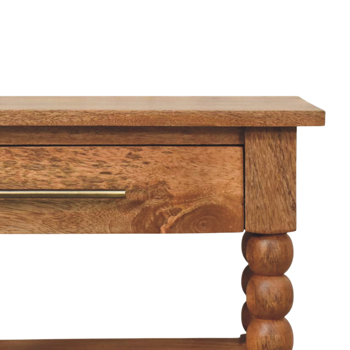 Close view of the drawer front and knob on the Langham Side Table in Amber.