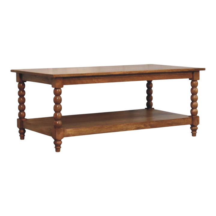 Langham Spindle Coffee Table in Amber, three-quarter view showing the full profile.