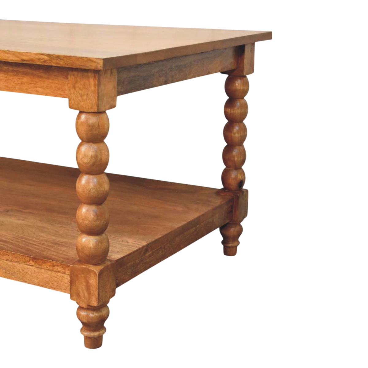 Close view of the shelf on the Langham Spindle Coffee Table in Amber.