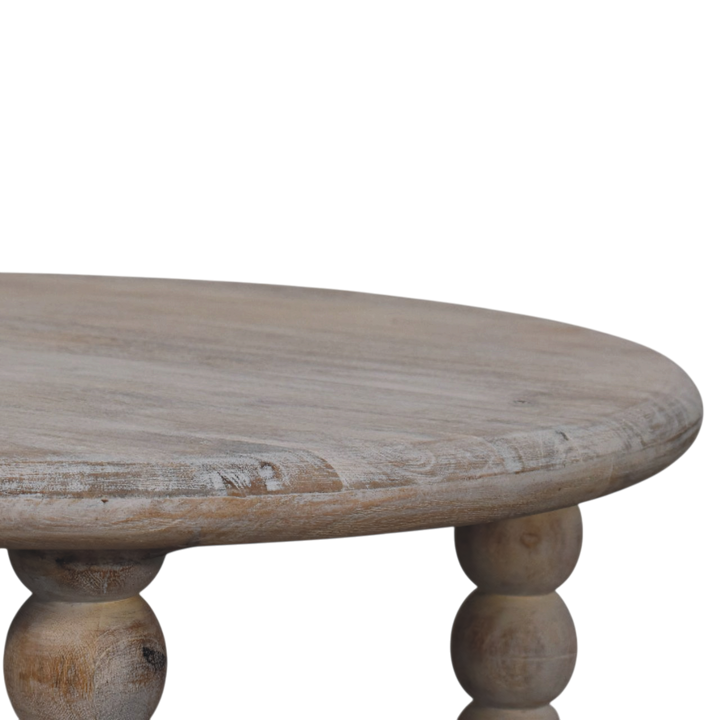 Close view of the top on the Langham Spindle Coffee Table in Driftwood.