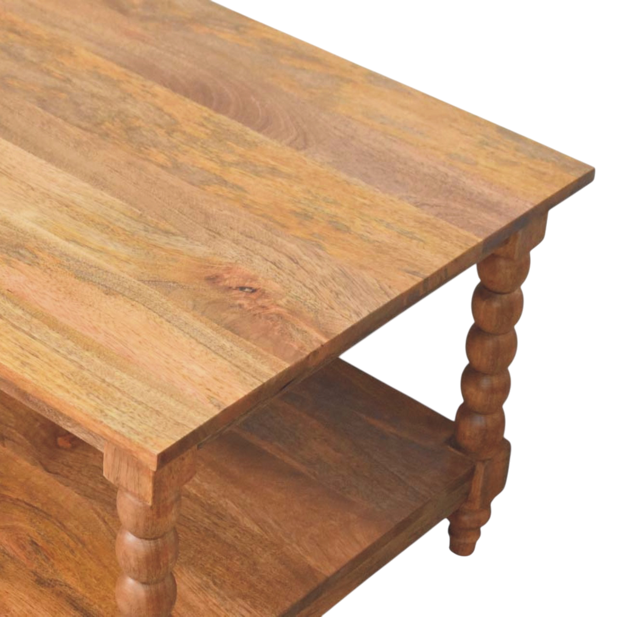 Close view of the shelf on the Langham Spindle Coffee Table in Russet.