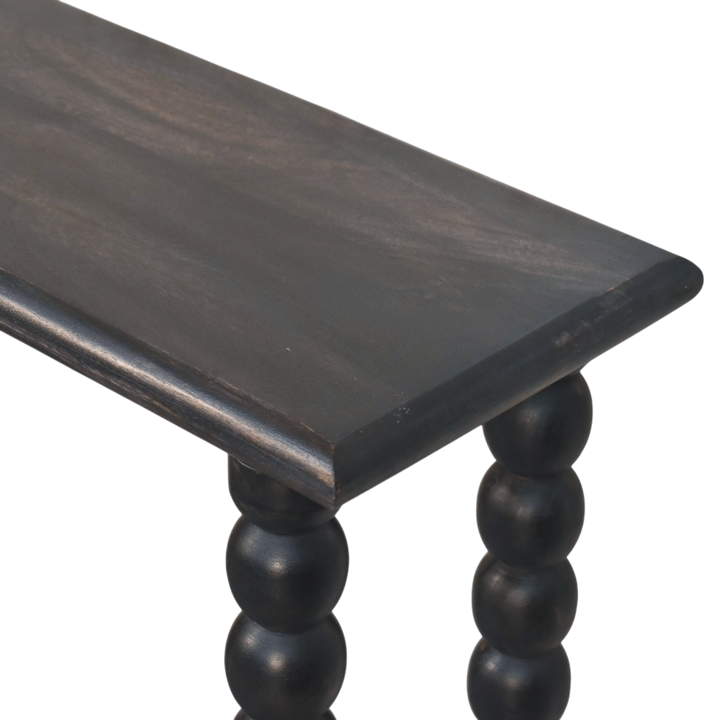 Close view of the top on the Langham Spindle Console in Charcoal.