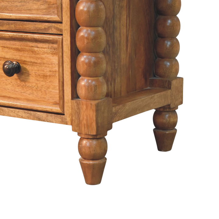 Close view of the bobbin turning on the Langham Spindle Media Unit in Amber.