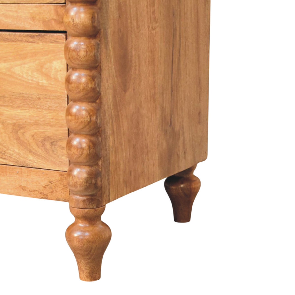 Close view of the legs on the Langham Wide 3-Drawer Dresser in Amber.