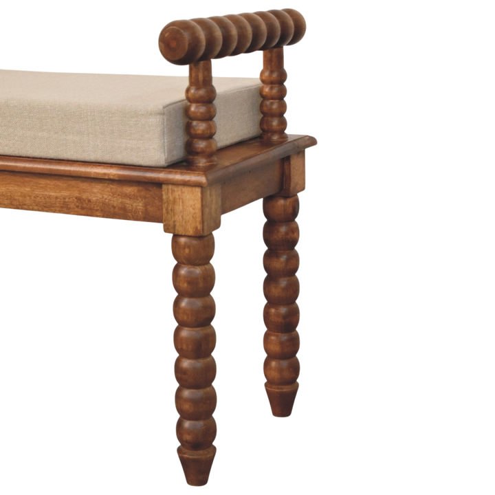 Close view of the rolled arm and upholstery on the Langham Window Bench in Amber with Clay Linen.