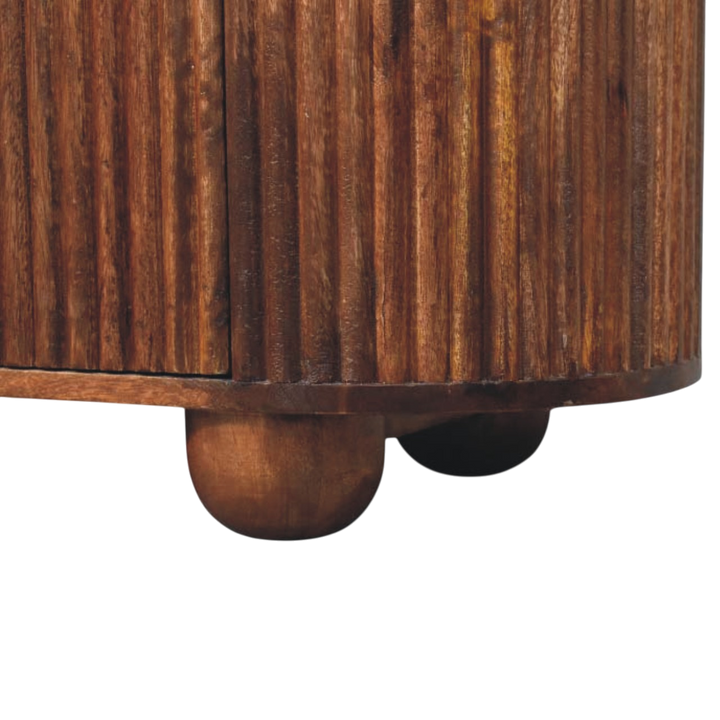 Close view of the feet on the Lansdowne 6-Drawer Chest in Almond.