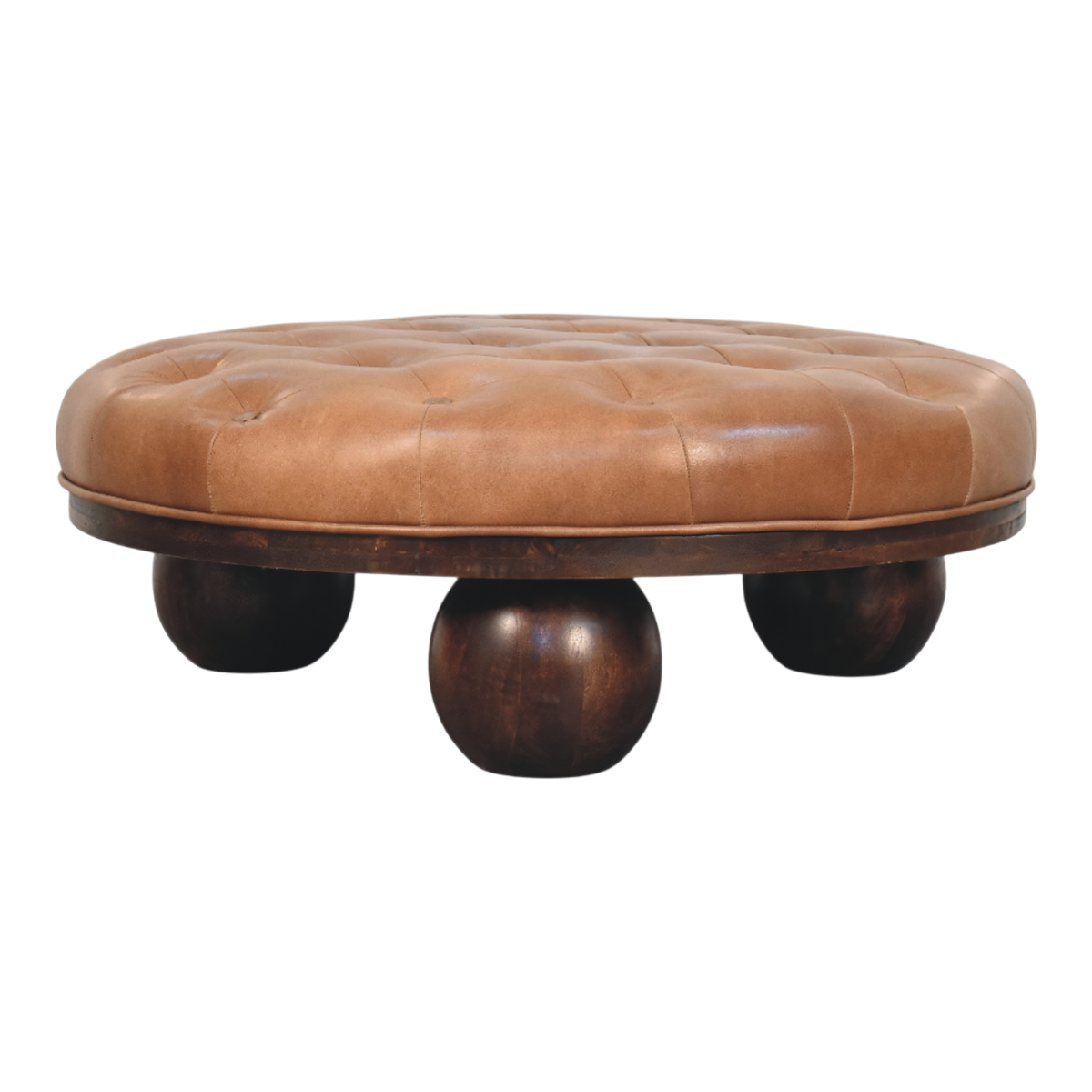 Lucca Round Leather Coffee Table in Burnt Caramel, front view. Tufted leather top in burnt caramel over a solid hardwood base, carved ball feet.