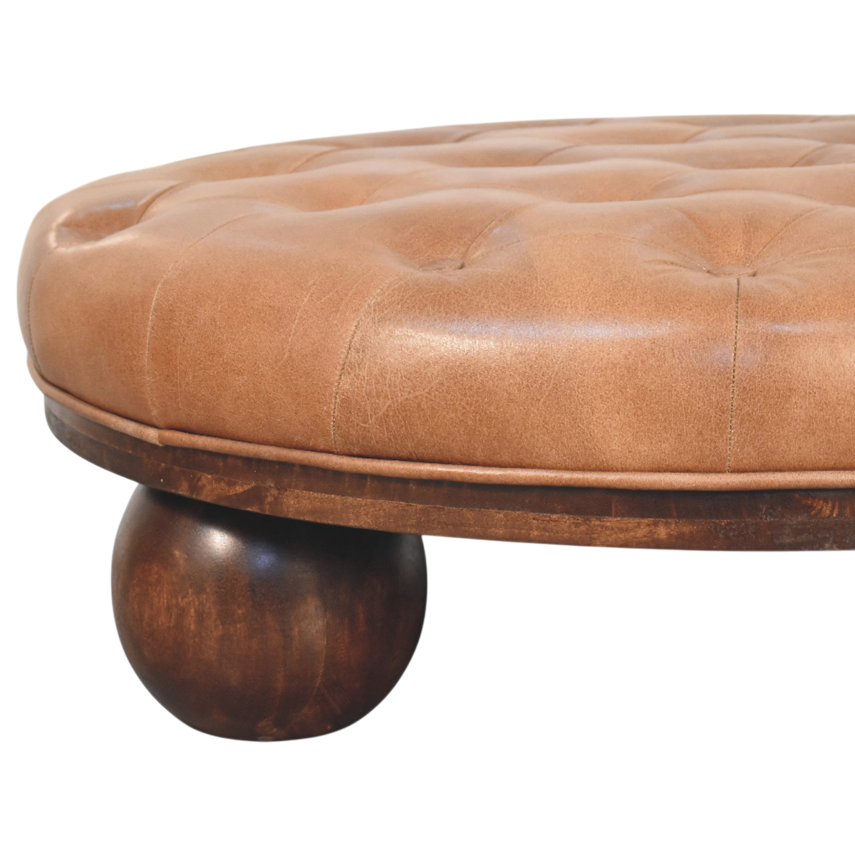 Close view of the feet on the Lucca Round Leather Coffee Table in Burnt Caramel.