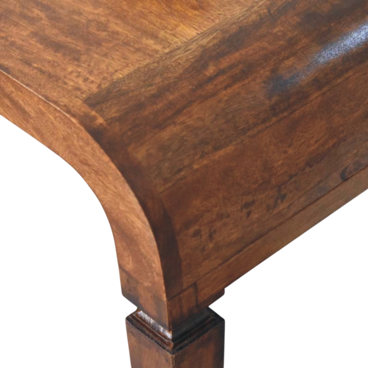 Close view of the edge on the Marlow Curved Console Table in Chestnut.