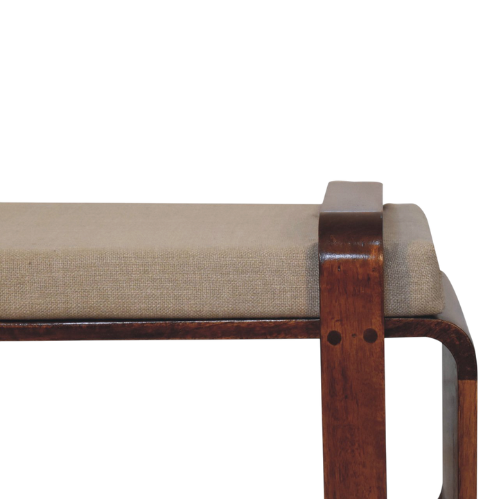 Close view of the frame on the Marlow Loop Bench in Chestnut with Clay Linen.