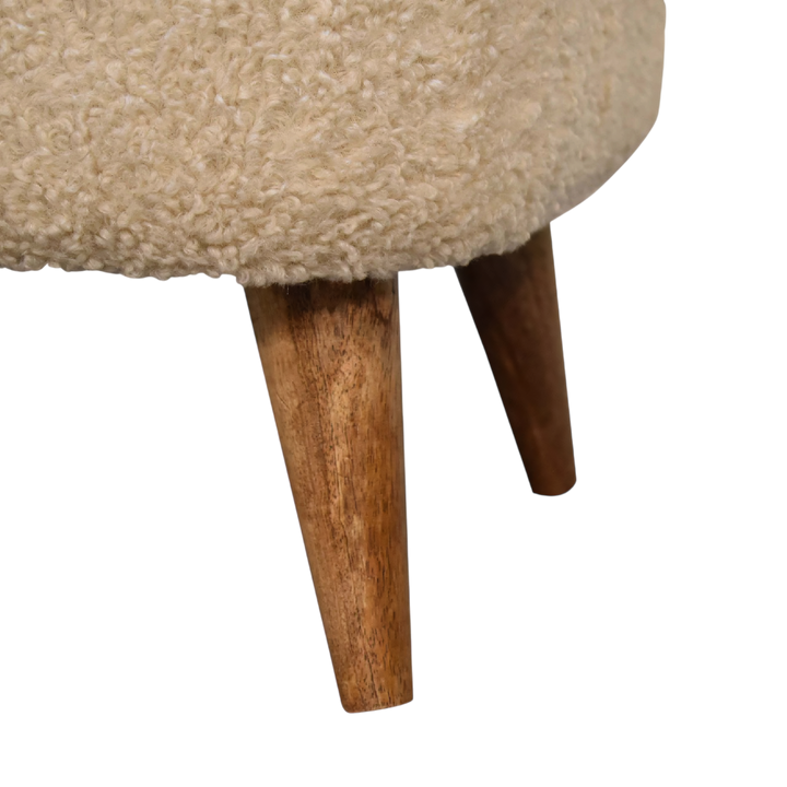 Close view of the turned legs on the Marlow Square Footstool in Cream Bouclé.