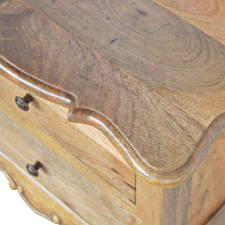 Close view of the drawer front on the Mirabel 2-Drawer Bedside Table in Amber.
