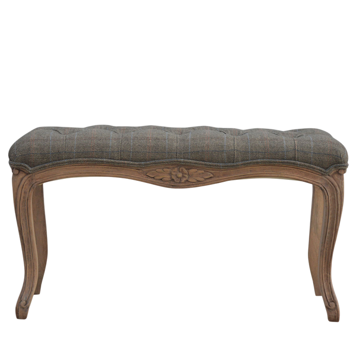 Mirabel Carved Bench in Heritage Tweed, front view. Heritage tweed in mixed wool, antique brass stud edging.