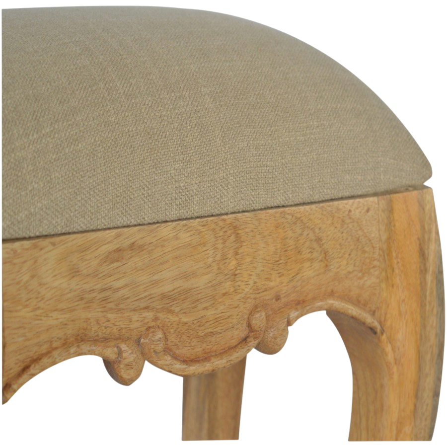 Close view of the carved detailing on the Mirabel Dressing Stool in Clay Linen.