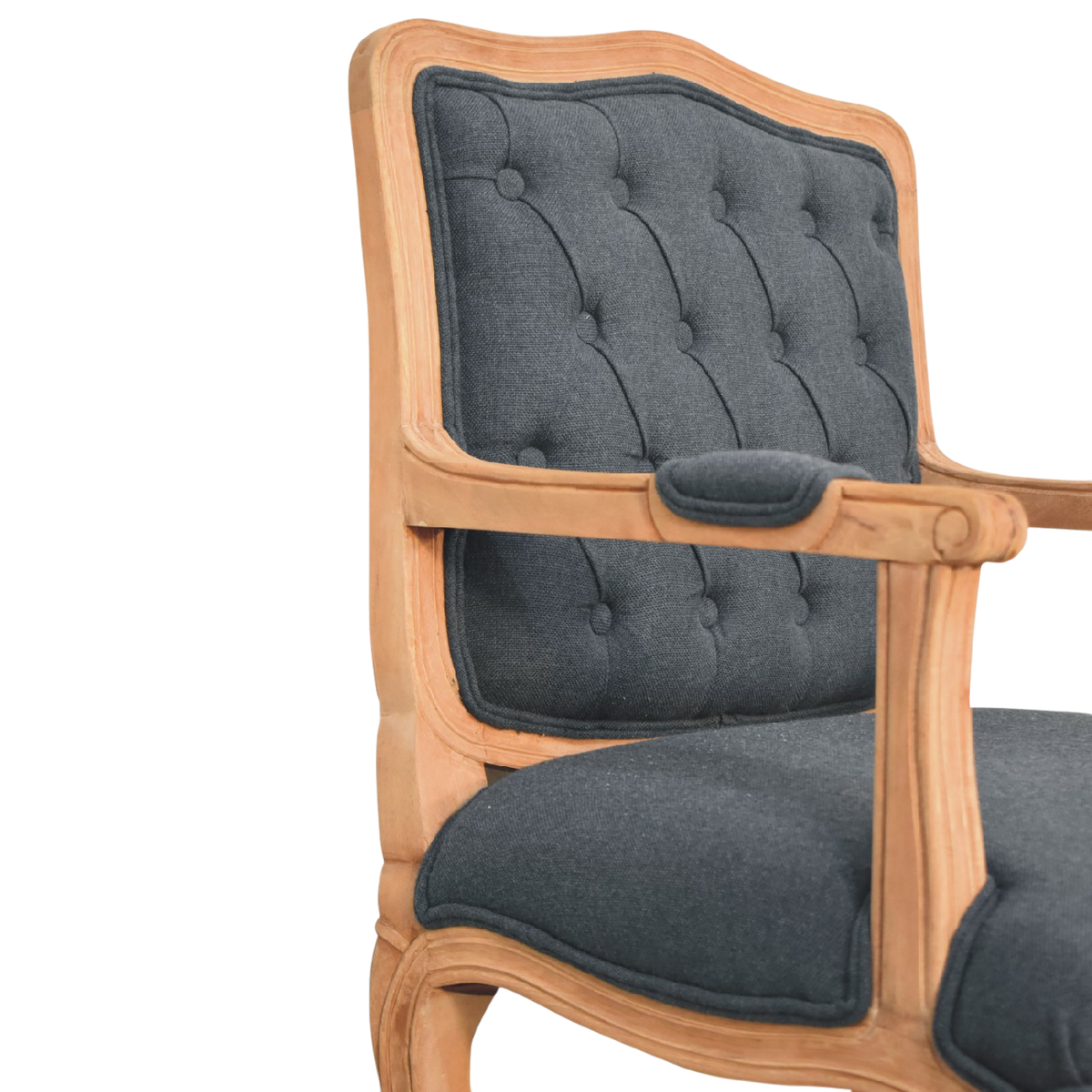 Close view of the button tufting and upholstery on the Mirabel Salon Chair in Ink.