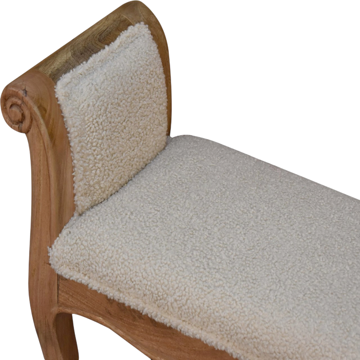 Close view of the arm on the Mirabel Scroll-Arm Bench in Cream Bouclé.
