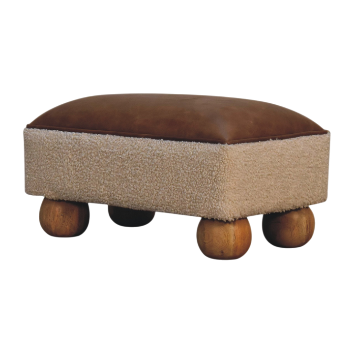 Oakhurst Ball-Foot Footstool in Cream Bouclé with Cognac Leather, three-quarter view showing the full profile.